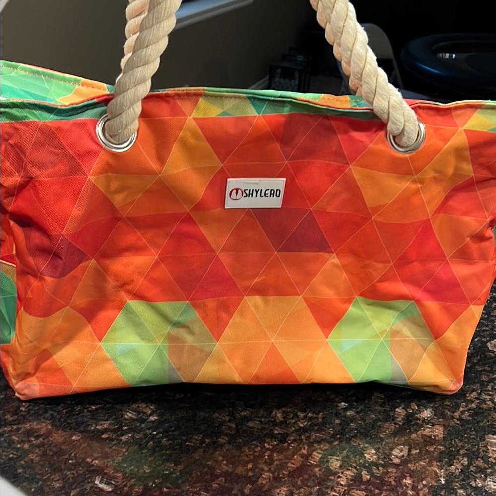 Consuela Orange and Green Geometric Travel Bag
